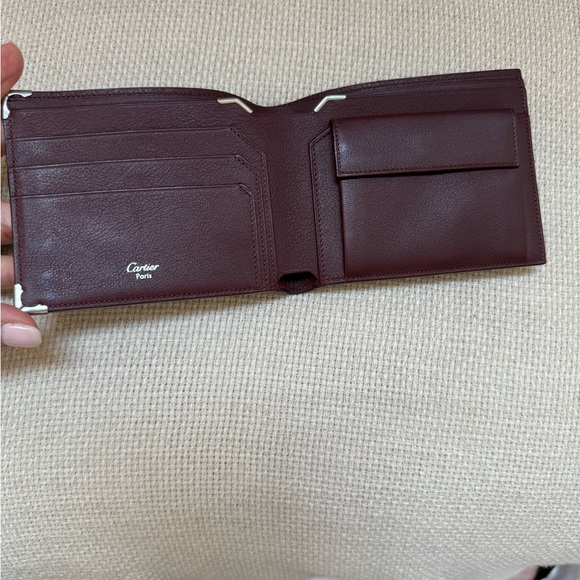 Cartier wallet. NWOT Brown exterior, burgundy interior. Shopping bag included. - Picture 4 of 10